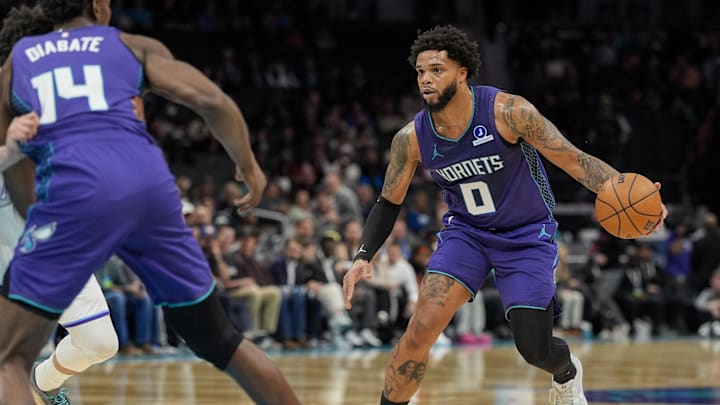 Nov 2, 2025; Charlotte, North Carolina, USA; Charlotte Hornets forward Miles Bridges (0) drives to the basket against the Utah Jazz during the first quarter at Spectrum Center. Mandatory Credit: Jim Dedmon-Imagn Images