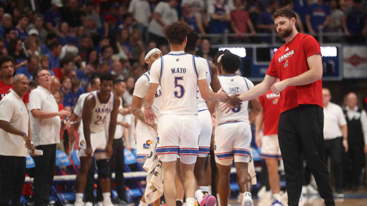 Kansas Jayhawks center Hunter Dickinson (1) greets players back to the bench in the first half of the game against Washburn inside Allen Fieldhouse Tuesday, Oct. 29, 2024.