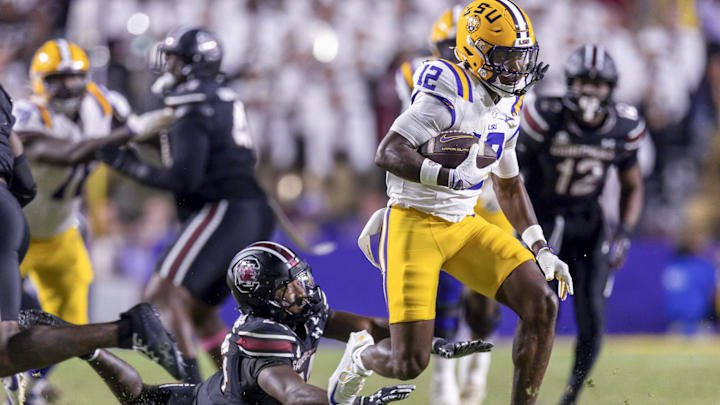 Oct 11, 2025; Baton Rouge, Louisiana, USA; LSU Tigers wide receiver Kyle Parker (12) catches a pass against South Carolina Gamecocks defensive back Jalon Kilgore (24) during the second half at Tiger Stadium. Mandatory Credit: Stephen Lew-Imagn Images Oct 11, 2025; Baton Rouge, Louisiana, USA; LSU Tigers wide receiver Kyle Parker (12) catches a pass against South Carolina Gamecocks defensive back Jalon Kilgore (24) during the second half at Tiger Stadium. Mandatory Credit: Stephen Lew-Imagn Images