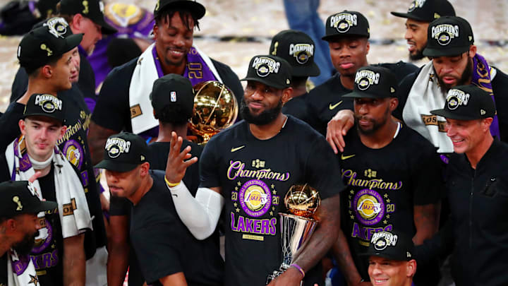 Oct 11, 2020; Lake Buena Vista, Florida, USA; Los Angeles Lakers forward LeBron James (23) holds up four fingers after winning his fourth NBA championship after game six of the 2020 NBA Finals at AdventHealth Arena. The Los Angeles Lakers won 106-93 to win the series. Mandatory Credit: Kim Klement-Imagn Images