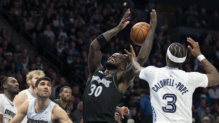 Dec 17, 2025; Minneapolis, Minnesota, USA; Minnesota Timberwolves forward Julius Randle (30) and Memphis Grizzlies guard Kentavious Caldwell-Pope (3) fight for a rebound in the second half at Target Center. Mandatory Credit: Jesse Johnson-Imagn Images Dec 17, 2025; Minneapolis, Minnesota, USA; Minnesota Timberwolves forward Julius Randle (30) and Memphis Grizzlies guard Kentavious Caldwell-Pope (3) fight for a rebound in the second half at Target Center. Mandatory Credit: Jesse Johnson-Imagn Images