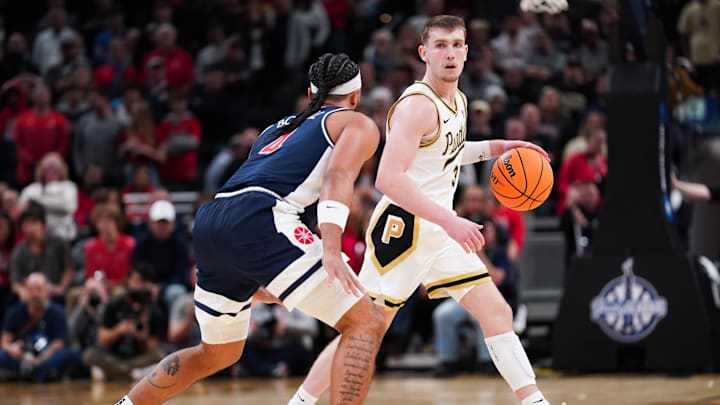 Purdue Boilermakers guard Braden Smith (3) dribbles against Arizona Wildcats guard Kylan Boswell (4).