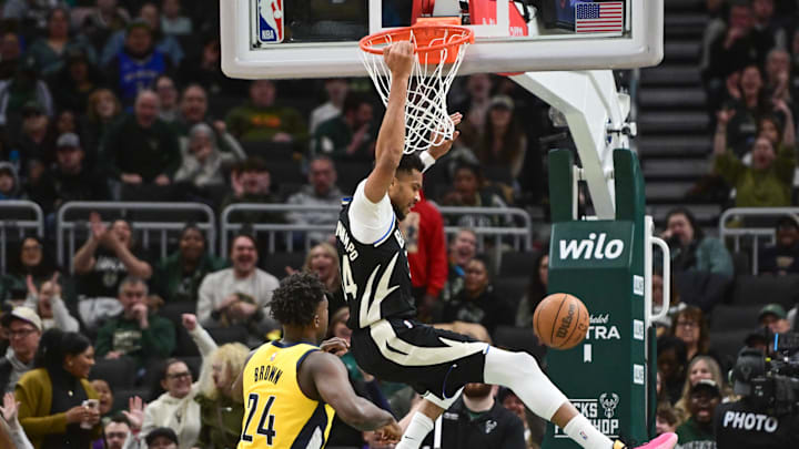 Mar 15, 2026; Milwaukee, Wisconsin, USA;  Milwaukee Bucks forward Giannis Antetokounmpo (34) dunks the ball against Indiana Pacers forward Kobe Brown (24) in the third quarter at Fiserv Forum. Mandatory Credit: Benny Sieu-Imagn Images