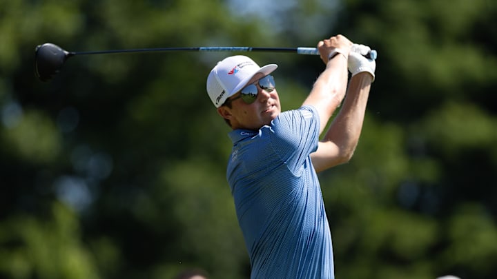 Ben Griffin plays his shot from the first tee during the first round of the Travelers Championship golf tournament. 