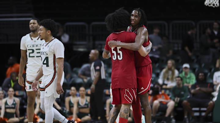 Jan 10, 2024; Coral Gables, Florida, USA; Louisville Cardinals guard Mike James (0) hugs Louisville