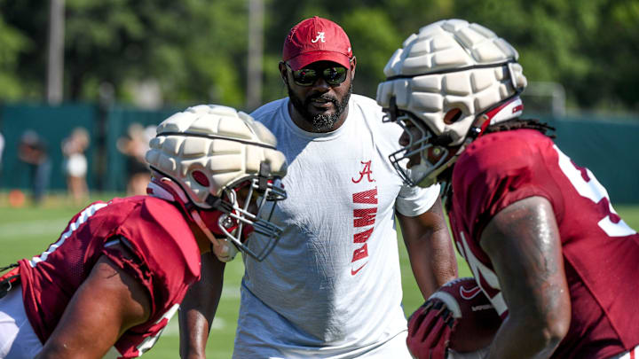 The Crimson Tide players and coaches continue working toward the season opener in practice Tuesday, Aug. 13, 2024. Alabama defensive line coach Freddie Roach works his players.