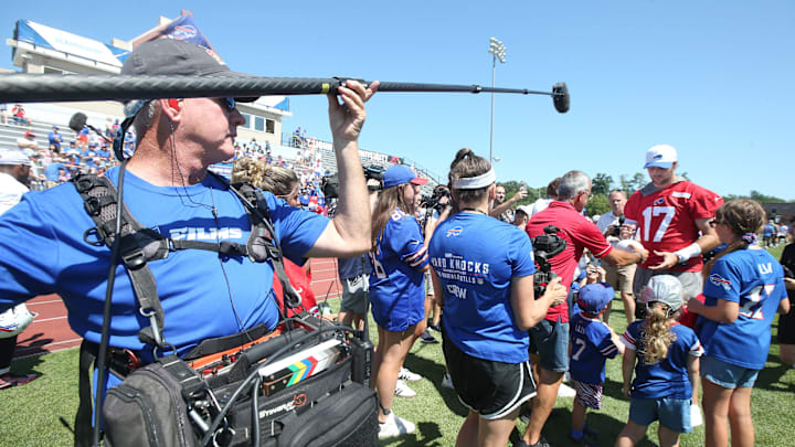 A camera crew from 'Hard Knocks' follow Bills quarterback Josh Allen as he signs autographs for fans during the opening day of Buffalo Bills training camp at St. John Fisher University Wednesday, July 23, 2025 in Pittsford.