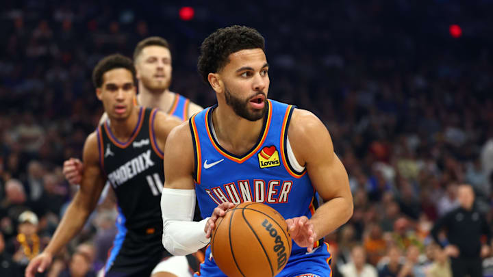 Apr 27, 2026; Phoenix, Arizona, USA; Oklahoma City Thunder guard Ajay Mitchell (25) against the Phoenix Suns during game four of the first round of the 2026 NBA Playoffs at Mortgage Matchup Center. Mandatory Credit: Mark J. Rebilas-Imagn Images