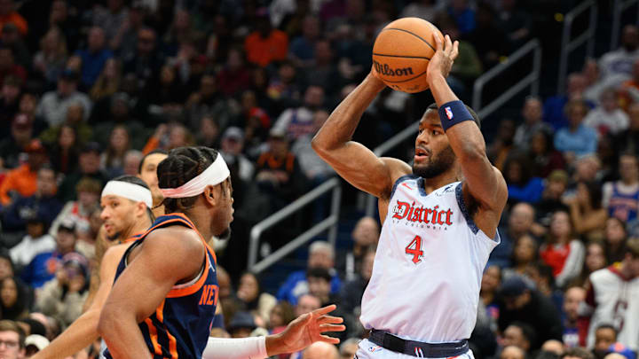 Dec 30, 2024; Washington, District of Columbia, USA; Washington Wizards guard Jared Butler (4) looks to pass as New York Knicks guard Miles McBride (2) defends during the fourth quarter at Capital One Arena. Mandatory Credit: Reggie Hildred-Imagn Images
