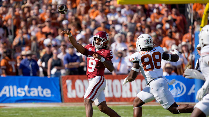 Oklahoma Sooners quarterback Michael Hawkins Jr. (9) throws a pass as Texas Longhorns linebacker Barryn Sorrell (88) chases after him during the Red River Rivalry college football game between the University of Oklahoma Sooners (OU) and the Texas Longhorns at the Cotton Bowl in Dallas, Saturday, Oct. 12, 2024. Texas one 34-3.