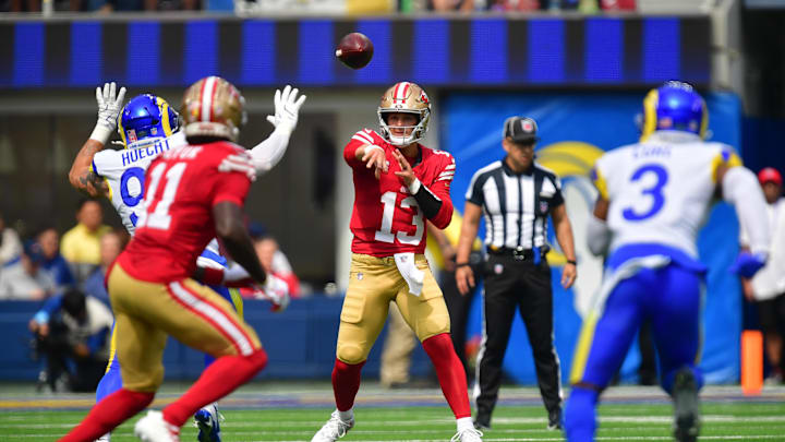 Sep 22, 2024; Inglewood, California, USA; San Francisco 49ers quarterback Brock Purdy (13) throws a pass to wide receiver Brandon Aiyuk (11) against the Los Angeles Rams during the first half at SoFi Stadium. Mandatory Credit: Gary A. Vasquez-Imagn Images