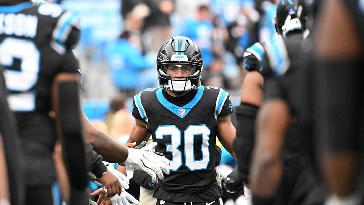 Carolina Panthers running back Chuba Hubbard (30) runs on to the field before the game Carolina Panthers running back Chuba Hubbard (30) runs on to the field before the game