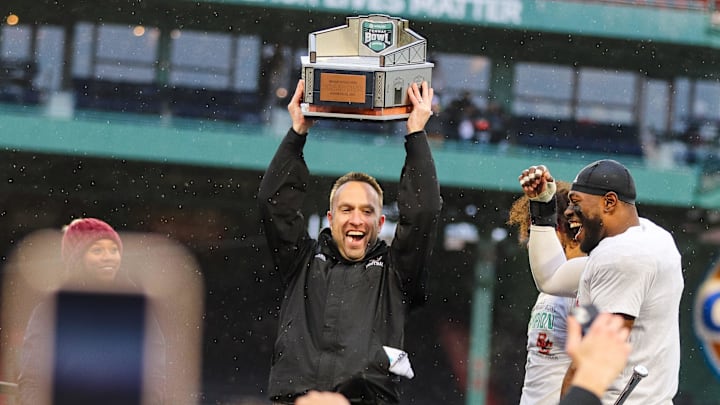 Boston College head coach Jeff Hafley hoists the trophy after winning the second annual Wasabi Fenway Bowl vs. SMU at Fenway Park on Thursday, Dec. 28, 2023.