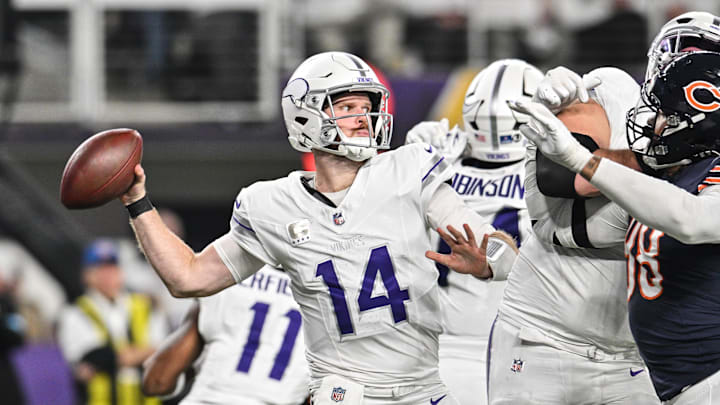 Dec 16, 2024; Minneapolis, Minnesota, USA; Minnesota Vikings quarterback Sam Darnold (14) throws a pass against the Chicago Bears during the third quarter at U.S. Bank Stadium. Mandatory Credit: Jeffrey Becker-Imagn Images