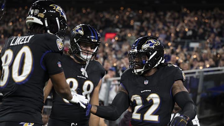 Baltimore Ravens running back Derrick Henry (22) celebrates with teammates after scoring a touchdown against the Buffalo Bills at M&T Bank Stadium. 