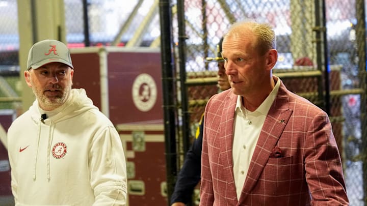 Nov 29, 2025; Auburn, Alabama, USA; Alabama head coach Kalen DeBoer enters Jordan-Hare Stadium ahead of the game with Auburn in the 2025 Iron Bowl. Mandatory Credit: Gary Cosby Jr.-Tuscaloosa News