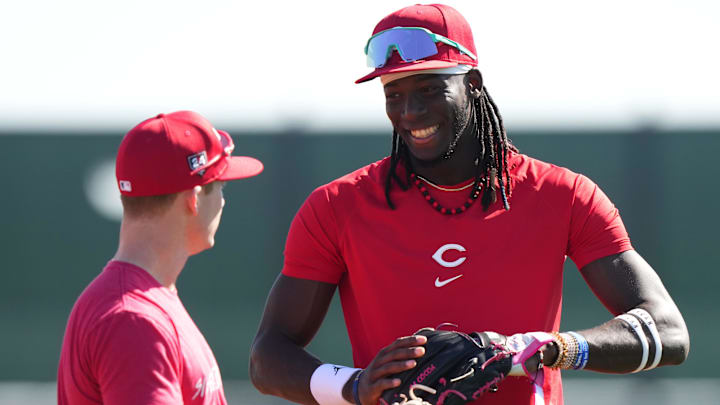 Feb 14, 2024; Goodyear, AZ, USA; Cincinnati Reds third baseman Elly De La Cruz (44) and Cincinnati Reds shortstop Matt McLain (9) share a high during spring training workouts. Mandatory Credit: Kareem Elgazzar/The Enquirer-Imagn Images