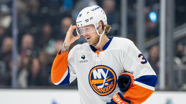 Jan 21, 2026; Seattle, Washington, USA; New York Islanders defenseman Adam Boqvist (34) adjusts his visor during a game against the Seattle Kraken at Climate Pledge Arena. Mandatory Credit: Stephen Brashear-Imagn Images