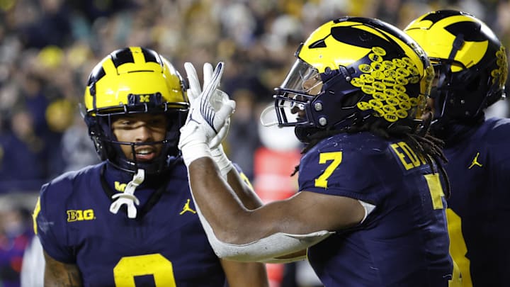 Nov 23, 2024; Ann Arbor, Michigan, USA;  Michigan Wolverines running back Donovan Edwards (7) celebrates after a touchdown against the Northwestern Wildcats in the second half at Michigan Stadium. Mandatory Credit: Rick Osentoski-Imagn Images