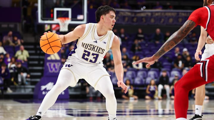 Dec 13, 2025; Seattle, Washington, USA; Washington Huskies guard JJ Mandaquit (23) looks to pass in the second half against the Southern Utah Thunderbirds at Alaska Airlines Arena at Hec Edmundson Pavilion. Mandatory Credit: Kevin Ng-Imagn Images Dec 13, 2025; Seattle, Washington, USA; Washington Huskies guard JJ Mandaquit (23) looks to pass in the second half against the Southern Utah Thunderbirds at Alaska Airlines Arena at Hec Edmundson Pavilion. Mandatory Credit: Kevin Ng-Imagn Images