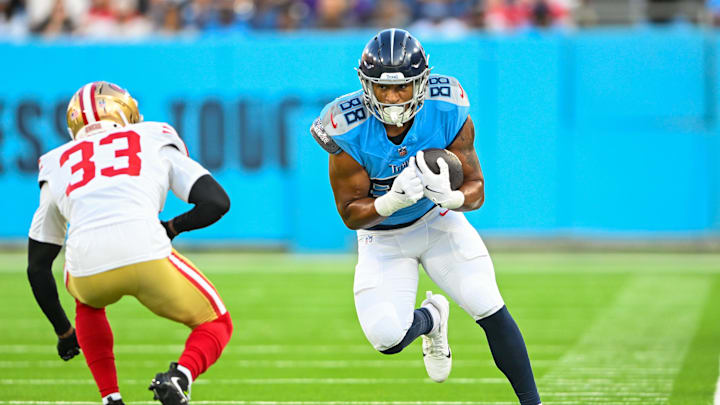 Aug 10, 2024; Nashville, Tennessee, USA;  Tennessee Titans tight end David Martin-Robinson (88) runs through San Francisco 49ers cornerback Rock Ya-Sin (33) during the first half at Nissan Stadium. Mandatory Credit: Steve Roberts-Imagn Images