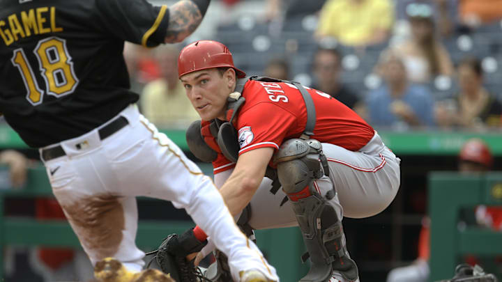 Cincinnati Reds catcher Tyler Stephenson (37) eyes a tag.