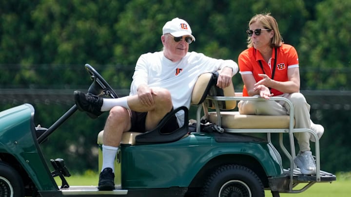 Cincinnati Bengals executives Mike Brown and his daughter Katie Blackburn talk on the sideline during a session of organized team activities on the Bengals practice field at Paycor Stadium in downtown Cincinnati on Tuesday, June 3, 2025.