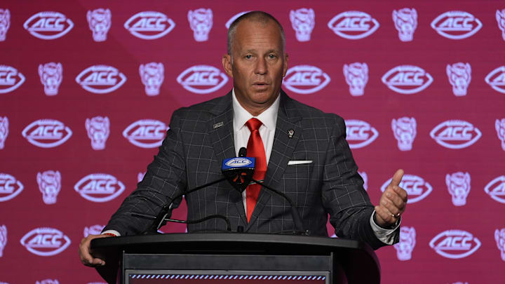 Jul 25, 2024; Charlotte, NC, USA;  North Carolina State Wolfpack head coach Dave Doeren speaks to the media during the ACC Kickoff at Hilton Charlotte Uptown. Mandatory Credit: Jim Dedmon-Imagn Images