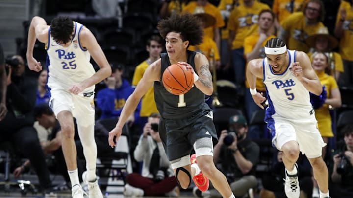 Feb 25, 2025; Pittsburgh, Pennsylvania, USA;  Georgia Tech Yellow Jackets guard Naithan George (1) dribbles against the Pittsburgh Panthers during the first half at the Petersen Events Center. Mandatory Credit: Charles LeClaire-Imagn Images