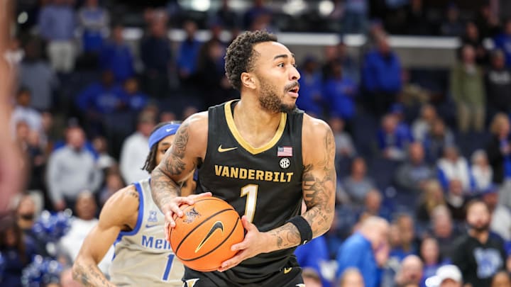 Dec 17, 2025; Memphis, Tennessee, USA; Vanderbilt Commodores guard Frankie Collins (1) looks to pass the ball against the Memphis Tigers during the second half at FedExForum. Mandatory Credit: Wesley Hale-Imagn Images