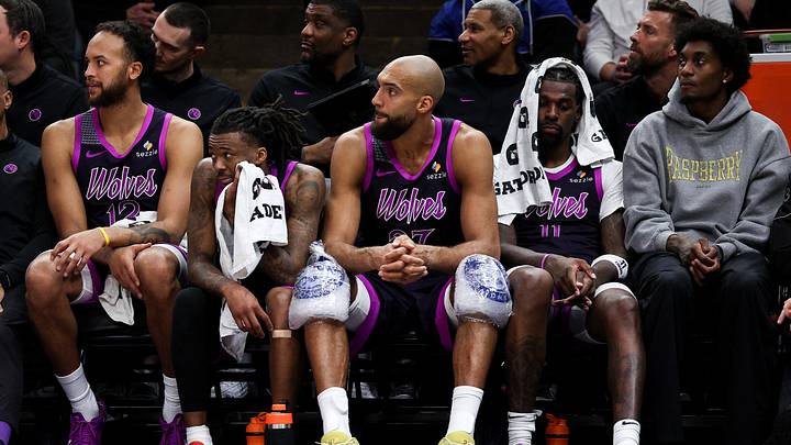 Mar 28, 2026; Minneapolis, Minnesota, USA; Minnesota Timberwolves players react on the bench during the second half against the Detroit Pistons at Target Center. 