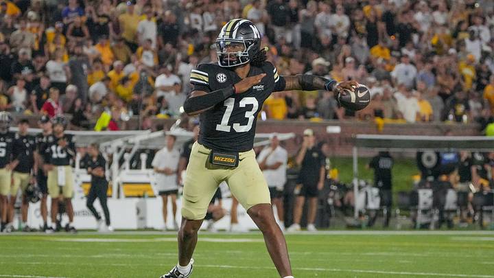 Sep 19, 2026; Columbia, Missouri, USA; Missouri Tigers quarterback Austin Simmons (13) throws a pass against the Troy Trojans during the first half of the game at Faurot Field at Memorial Stadium. Mandatory Credit: Denny Medley-Imagn Images