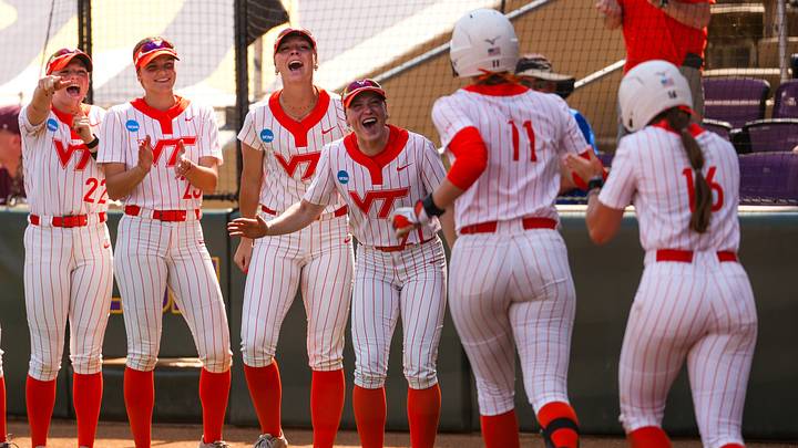 The Hokies celebrate outside of their dugout. The Hokies celebrate outside of their dugout.