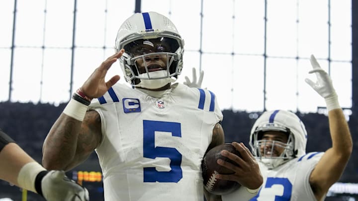 Dec 22, 2024; Indianapolis, Indiana, USA; Indianapolis Colts quarterback Anthony Richardson (5) celebrates after rushing for a touchdown during a game against the Tennessee Titans at Lucas Oil Stadium. Mandatory Credit: Christine Tannous/USA Today Network via Imagn Images 