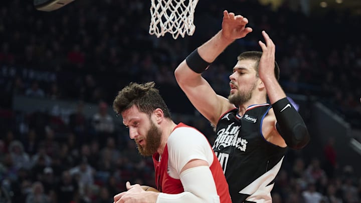 Nov 29, 2022; Portland, Oregon, USA;  Portland Trail Blazers center Jusuf Nurkic (27) grabs a rebound during the first half against LA Clippers center Ivica Zubac (40) at Moda Center. Mandatory Credit: Troy Wayrynen-Imagn Images