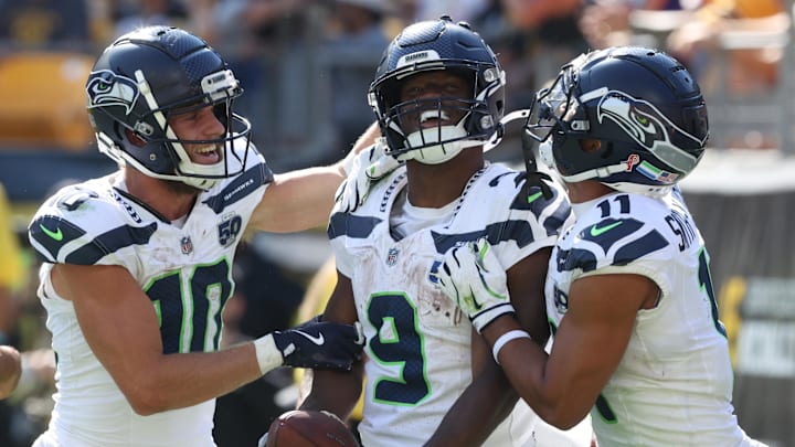 Sep 14, 2025; Pittsburgh, Pennsylvania, USA;  Seattle Seahawks wide receivers Cooper Kupp (10) and Jaxon Smith-Njigba (11) congratulate running back Kenneth Walker III (9) on his touchdown against the Pittsburgh Steelers during the fourth quarter at Acrisure Stadium. Mandatory Credit: Charles LeClaire-Imagn Images
