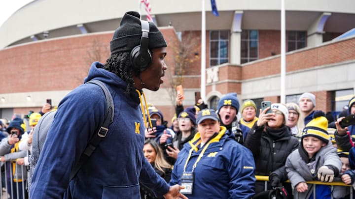 Michigan quarterback Bryce Underwood (19) waves at fans as the team arrive at Michigan Stadium in Ann Arbor ahead of the Ohio State game. Michigan quarterback Bryce Underwood (19) waves at fans as the team arrive at Michigan Stadium in Ann Arbor ahead of the Ohio State game.