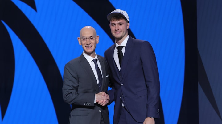 Jun 25, 2025; Brooklyn, NY, USA;  Cooper Flagg poses with NBA commissioner Adam Silver after being selected as first overall by the Dallas Mavericks in the first round of the 2025 NBA Draft at Barclays Center. Mandatory Credit: Brad Penner-Imagn Images