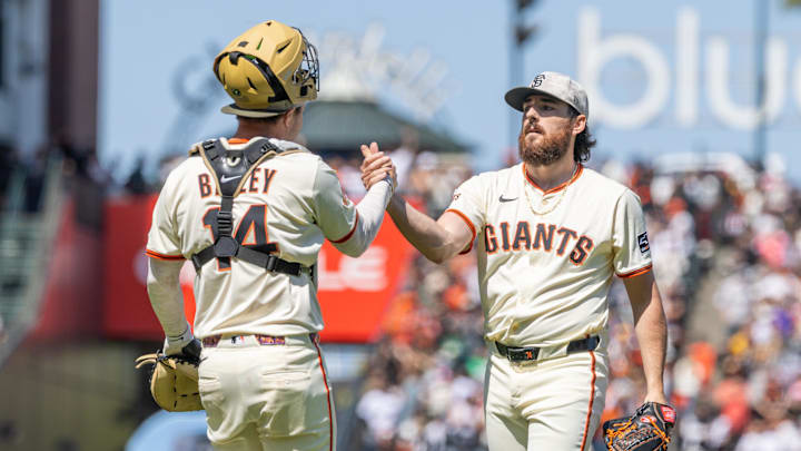 May 18, 2025; San Francisco, California, USA; San Francisco Giants pitcher Ryan Walker (74) and San Francisco Giants catcher Patrick Bailey (14) celebrate their victory against the Oakland Athletics at Oracle Park. Mandatory Credit: Bob Kupbens-Imagn Images