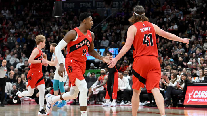 Mar 3, 2024; Toronto, Ontario, CAN;  Toronto Raptors forward RJ Barrett (9) slaps hands with center Kelly Olynyk (41) after scoring a basket against the Charlotte Hornets in the fourth quarter at Scotiabank Arena. Mandatory Credit: Dan Hamilton-USA TODAY Sports
