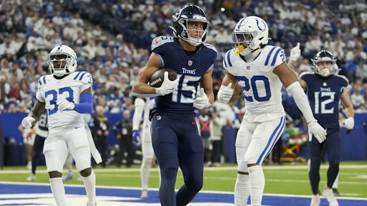 Dec 22, 2024; Indianapolis, Indiana, USA; Tennessee Titans wide receiver Nick Westbrook-Ikhine (15) scores a touchdown 4, during a game against the Indianapolis Colts at Lucas Oil Stadium. Mandatory Credit: Christine Tannous/USA Today Network via Imagn Images 