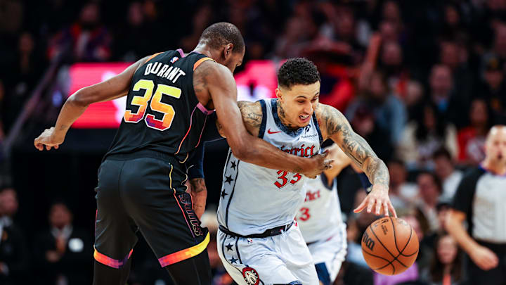 Jan 25, 2025; Phoenix, Arizona, USA; Washington Wizards forward Kyle Kuzma (33) controls the ball against Phoenix Suns forward Kevin Durant (35) during the third quarter at Footprint Center. Mandatory Credit: Aryanna Frank-Imagn Images