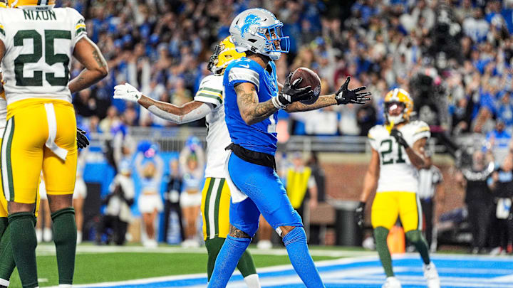 Detroit Lions wide receiver Tim Patrick (17) scores a touchdown against Green Bay Packers during the second half at Ford Field in Detroit on Thursday, Dec. 5, 2024.