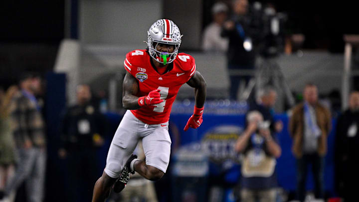 Jan 10, 2025; Arlington, TX, USA; Ohio State Buckeyes wide receiver Jeremiah Smith (4) in action during the game between the Texas Longhorns and the Ohio State Buckeyes at AT&T Stadium. Mandatory Credit: Jerome Miron-Imagn Images
