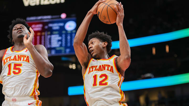 Oct 14, 2024; Atlanta, Georgia, USA; Atlanta Hawks forward De'Andre Hunter (12) grabs a rebound against the Philadelphia 76ers in the second quarter at State Farm Arena. Mandatory Credit: Brett Davis-Imagn Images Oct 14, 2024; Atlanta, Georgia, USA; Atlanta Hawks forward De'Andre Hunter (12) grabs a rebound against the Philadelphia 76ers in the second quarter at State Farm Arena. Mandatory Credit: Brett Davis-Imagn Images