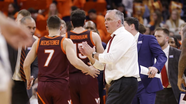 Feb 1, 2025; Charlottesville, Virginia, USA; Virginia Tech Hokies head coach Mike Young (center) reacts with players during a stoppage in play on the court against the Virginia Cavaliers in the second half at John Paul Jones Arena. Mandatory Credit: Amber Searls-Imagn Images