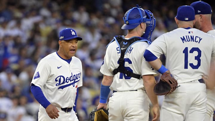 Oct 20, 2024; Los Angeles, California, USA; Los Angeles Dodgers manager Dave Roberts (30) meets on the mound in the third inning against the New York Mets during game six of the NLCS for the 2024 MLB playoffs at Dodger Stadium. Mandatory Credit: Jayne Kamin-Oncea-Imagn Images