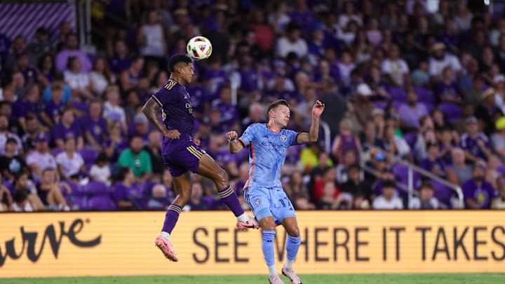 Jul 20, 2024; Orlando, Florida, USA; Orlando City forward Ramiro Enrique (7) heads the ball past New York City FC forward Hannes Wolff (17) in the first half at Inter&Co Stadium. Mandatory Credit: Nathan Ray Seebeck-USA TODAY Sports