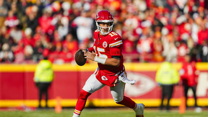 Dec 21, 2024; Kansas City, Missouri, USA; Kansas City Chiefs quarterback Patrick Mahomes (15) rolls out to pass during the first half against the Houston Texans at GEHA Field at Arrowhead Stadium. Mandatory Credit: Jay Biggerstaff-Imagn Images