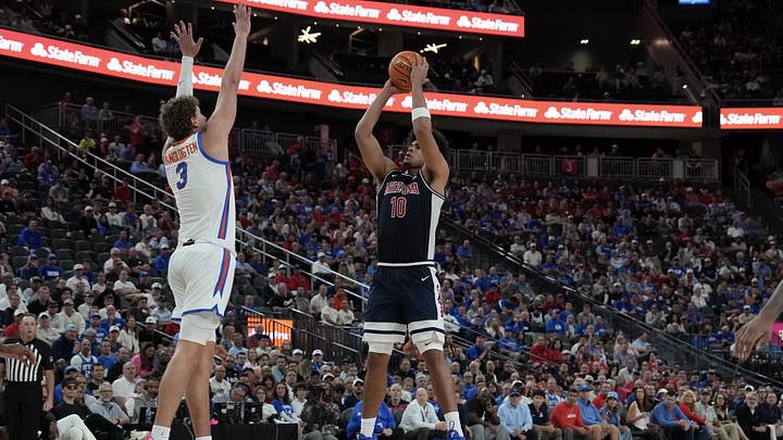 Nov 3, 2025; Las Vegas, NV, USA; Arizona Wildcats forward Koa Peat (10) shoots against Florida Gators center Micah Handlogten (3) during the second half of the Hall of Fame Series game at T-Mobile Arena. Mandatory Credit: Candice Ward-Imagn Images